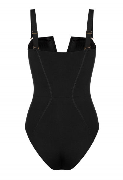 Close-up of a woman's black swimwear, focusing on the back detail and the hourglass shape